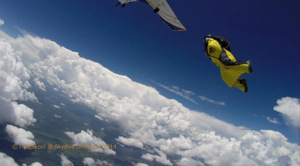 bill vance exits plane while wingsuit training at skydive university